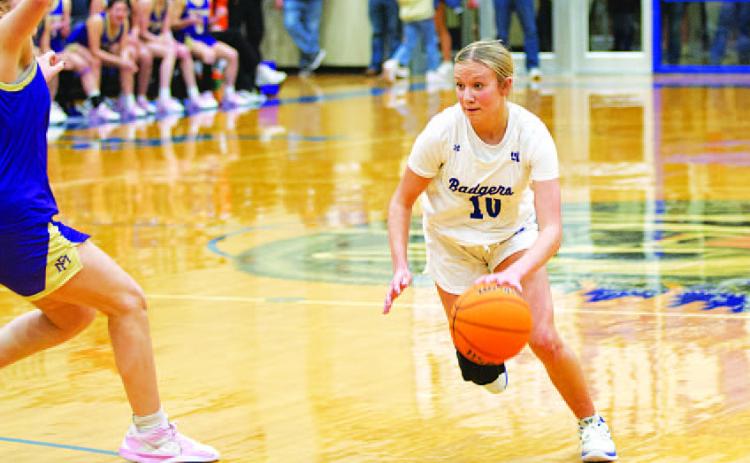 HUNTER KING | DISPATCH RECORD Tenley Langford dribbles past a defender in the fourth quarter of last Friday’s game.