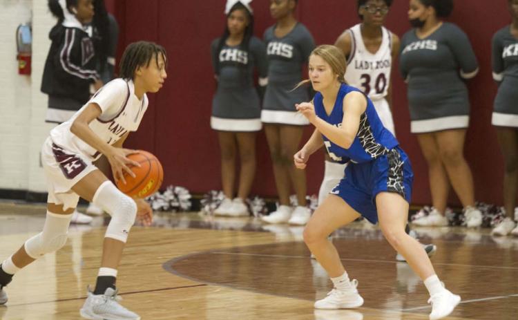 Hadley Oncken guards the Lady Roo ball handler in the second half of Tuesday’s game. HUNTER KING | DISPATCH RECORD