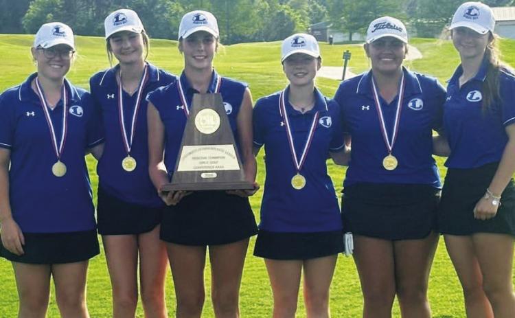 The Lady Badger golf team shows off their trophy and medals from winning the regional golf tournament last week. COURTESY PHOTO | LAMPASAS HIGH SCHOOL FACEBOOK