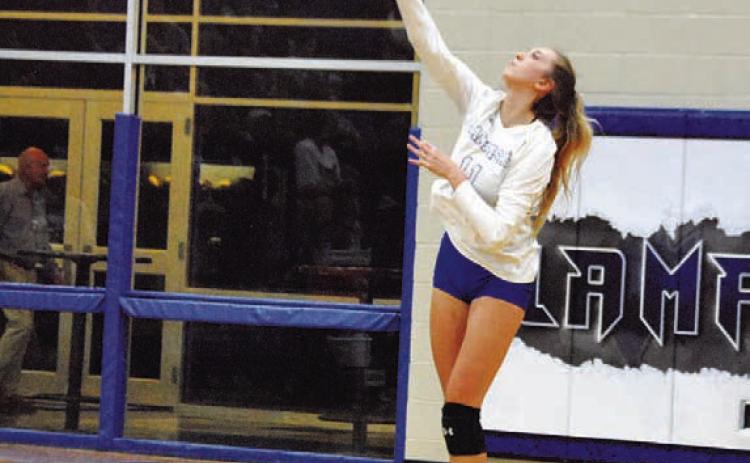 Breana Pelbath swings through a serve against the Shoemaker Lady Grey Wolves. HUNTER KING | DISPATCH RECORD
