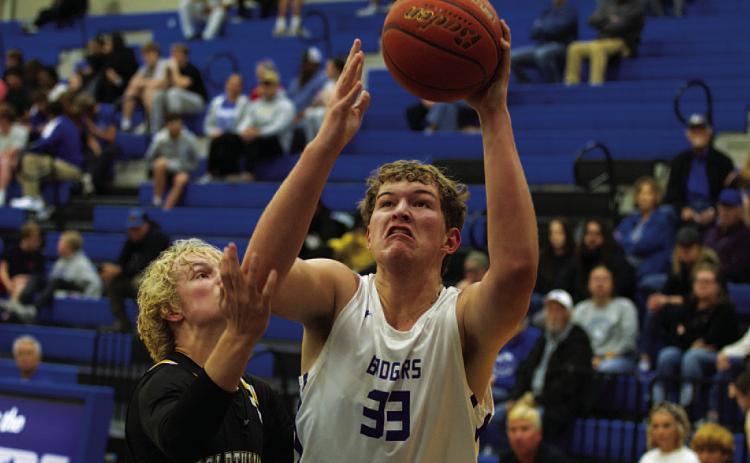 HUNTER KING | DISPATCH RECORD Beau Patterson fights through contact to finish at the rim against the Goldthwaite Eagles.