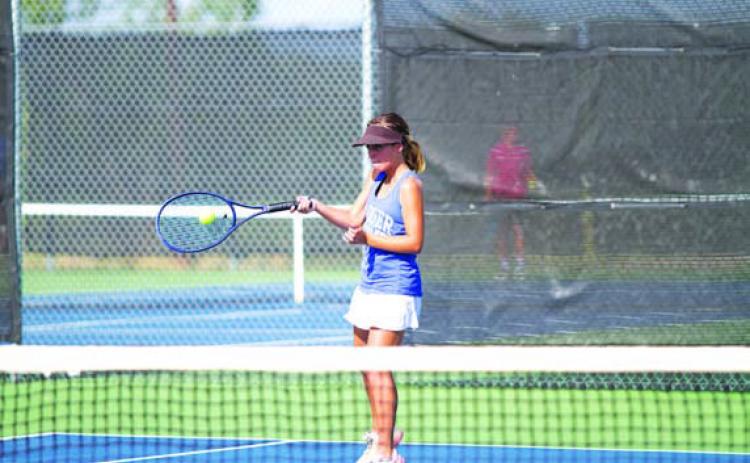 Sam Lopez hits a forehand shot during a match earlier this season. HUNTER KING | DISPATCH RECORD