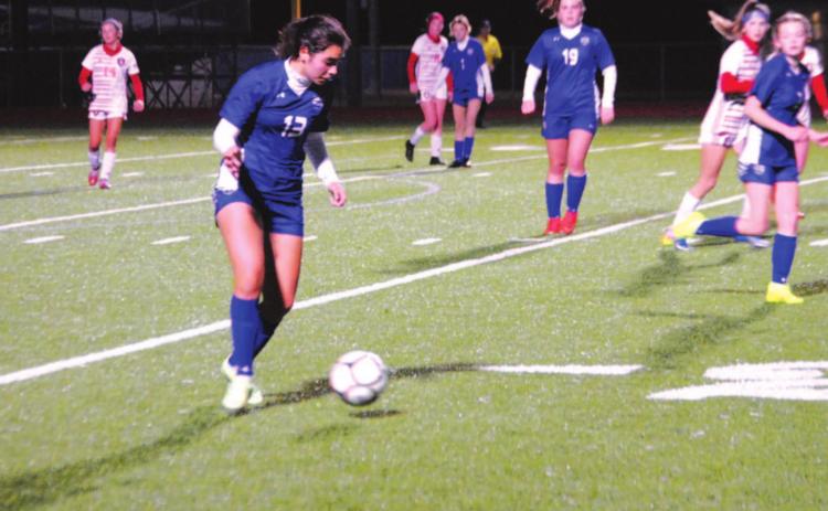 Tate Brown dribbles in the midfield and moves the ball up the field against the Salado Lady Eagles on Wednesday night. HUNTER KING | DISPATCH RECORD