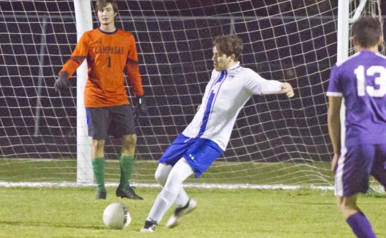 Nicholas Harron (4) clears the ball away from the Badger goal. Also pictured is goalkeeper Gavin Robinson, left. JEFF LOWE | DISPATCH RECORD