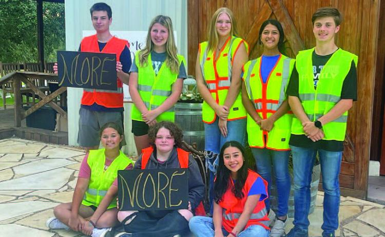 Lampasas High School Key Club members were on hand Oct. 9 at The Adelphia to offer assistance with parking for those who attended the MORE women’s event. Pictured are, front row from left, Emma Norton, Hailey Adams and Yoseline Montiel; and back row, Kaden Neuenschwander, Chloe Branum, Kaylee Pentz, Emily Gonzalez and Seth Kachel. COURTESY PHOTO