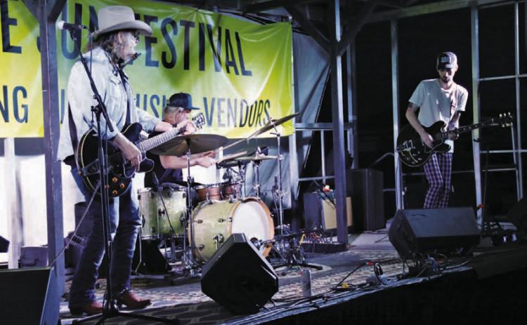 CHERI JAY-WIENECKE | DISPATCH RECORD Ray Wylie Hubbard, left, performs at the Sun Festival at Lometa Regional Park on Sunday. He is accompained by drummer Cal Schneider and guitarist Lucas Hubbard, pictured left to right. The festival featured live music and camping for the Monday eclipse.