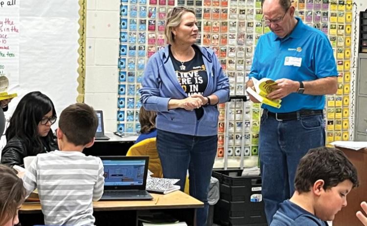 courtesy photo Putting dictionaries in the classroom The Copperas Cove Rotary Club donated dictionaries for every third-grade student at Taylor Creek Elementary School. Sarah Seidler and Tom Pursel, shown here, passed out the dictionaries and answered questions from students.