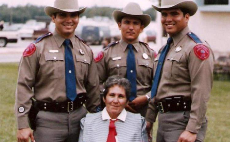 Brothers Jose “Joe” Ramos, at left, Juan “John” Ramos, back center, and Jesus “Jess” Ramos pose for a photo in Texas DPS uniform with their mother, Maria Luisa Ramos. courtesy photo