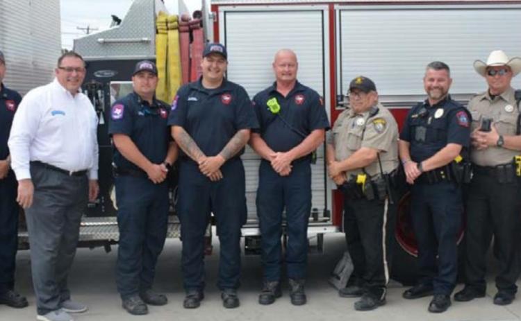 Members of the Hill Country 100 Club and Lampasas first responders gathered for this photo Monday. MONIQUE BRAND | DISPATCH RECORD
