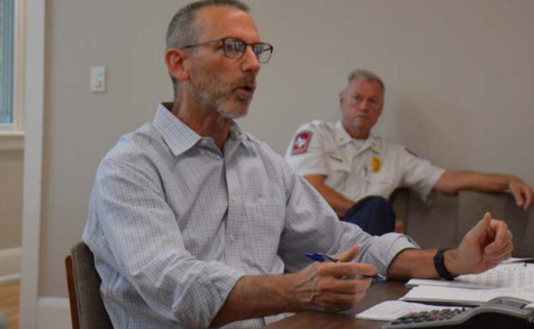 City Manager Finley deGraffenried talks to the Lampasas City Council during a budget roundtable session earlier this month, as Fire Chief Jeff Smith listens in the background. MONIQUE BRAND | DISPATCH RECORD