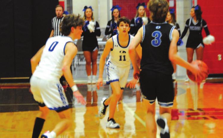 Luke Shivers and Nate Borchardt, left, prepare to trap the Decatur ball handler last Friday night. HUNTER KING | DISPATCH RECORD