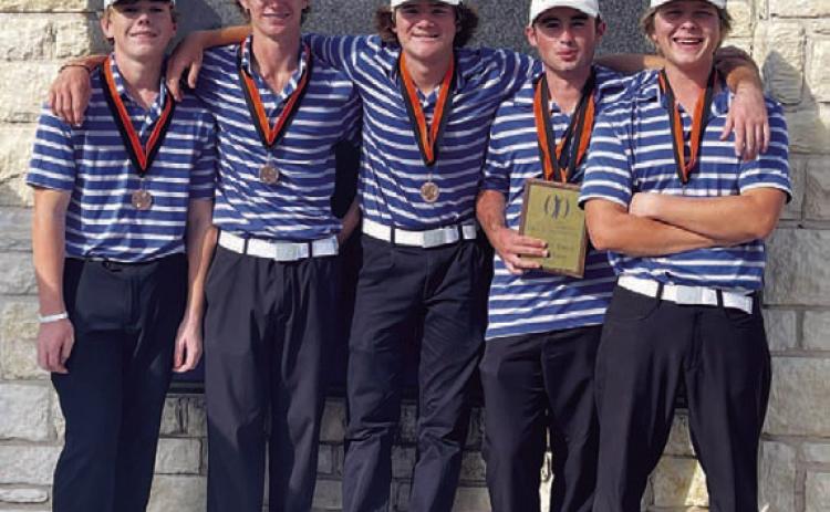 COURTESY PHOTO The Badger golf team poses with their medals and plaque.
