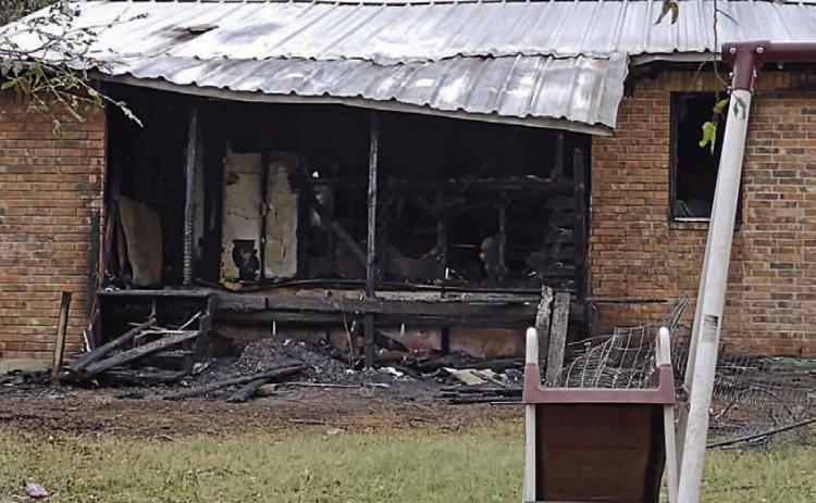 Extensive damage was done to the interior of this home on West First Street after a fire started Sunday on the back porch. DAVID LOWE | DISPATCH RECORD