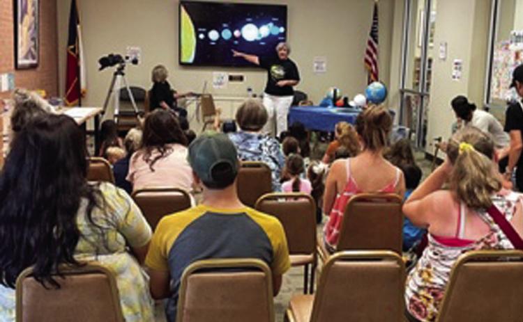Lampasas County Friends of the Night Sky was a part of the Lampasas Public Library’s Summer Reading Program for kids ages 3-10. Here, Dianna Hodges discusses the 2024 Solar Eclipse with the group. COURTESY PHOTO | FRIENDS OF THE NIGHT SKY