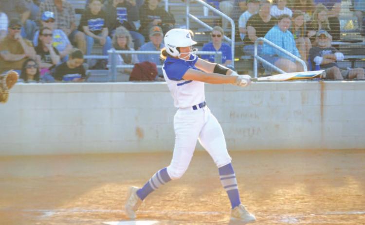 Hannah Perry follows through on a swing that sent the ball over the fence for her first home run of the game against Glen Rose last Friday. HUNTER KING | DISPATCH RECORD