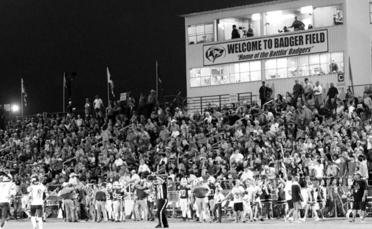 A large crowd enjoys a football game at Badger Field. If House Bill 547 passes this legislative session, homeschool students could be allowed to participate in UIL activities such as football. FILE PHOTO