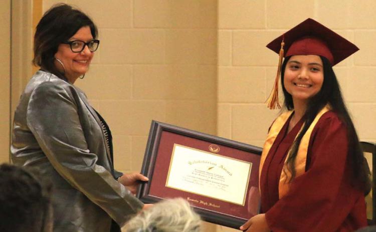 Salutatorian Elizabeth Carbajal, at right, receives her award certificate from Lometa Principal Amanda Morris. MASON HINES | DISPATCH RECORD