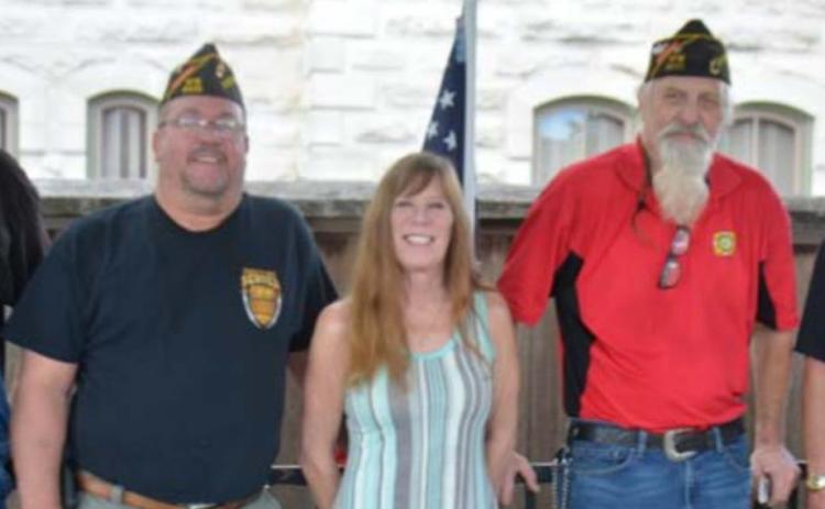 VFW members display the national emblem