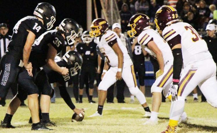 Adrian Smailus-Cruz, right, D.J. Smart and Elijah Gonzalez prepare to rush against Water Valley last Friday. JESSICA MALDONADO | DISPATCH RECORD