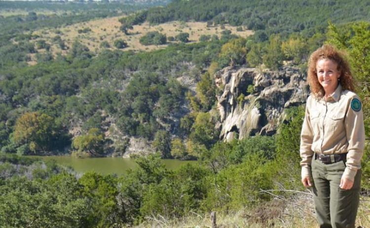 Kasey Sloan, park superintendent at Post Oak Ridge, stands at a vantage point that overlooks the Colorado River which forms the western edge of the new state park that straddles the Lampasas-Burnet County line northwest of Naruna. Day passes can be booked online for entrance to the property. COURTESY PHOTO | JEFF LOWE