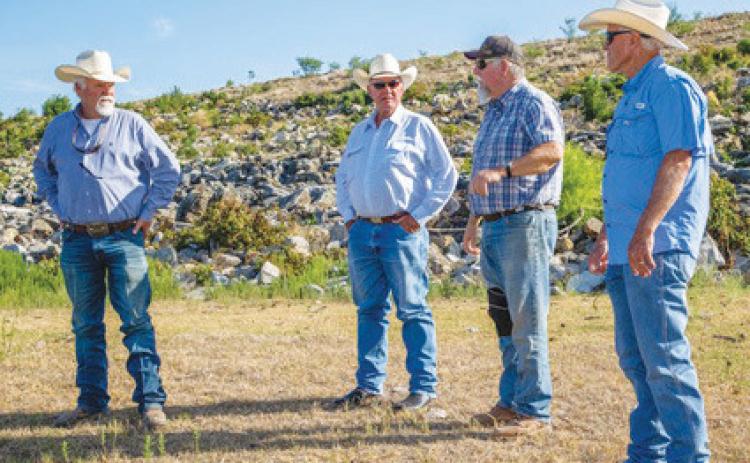 chris miles | dispatch record Sam Middleton of the Lubbock-based Chas. S. Middleton brokerage firm learns about the history of the Pillar Bluff Ranch. Pictured, left to right, are Kim Vann, Middleton, Kirk Vann and Robby Vann.