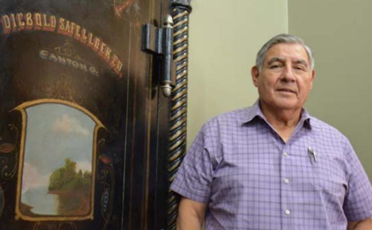 Longtime Precinct 1 Justice of the Peace Andrew Garcia Jr. stands by his office’s steel doorway, where he married many Lampsas County couples. MONIQUE BRAND | DISPATCH RECORD