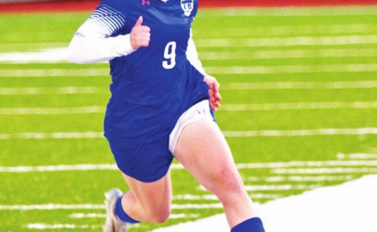 Bella Lindsey dribbles down the field during a match in her freshman season. FILE PHOTO