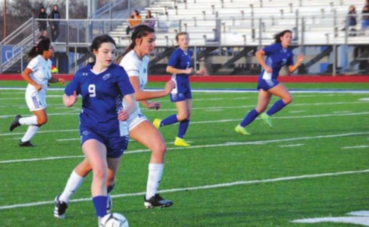 Bella Lindsey dribbles past Jarrell defenders during a previous game for the Lady Badgers. HUNTER KING | DISPATCH RECORD
