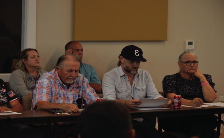 Lampasas Economic Development Corporation board members Deorald Finney (left), Fin Erwin and Tonja Gerbert listen to a presentation from EDC Specialist Mike Gill before discussing future plans with City Council Oct. 21. ERICK MITCHELL | DISPATCH RECORD
