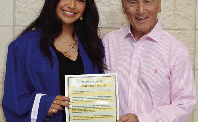 Amore Zapata, left, and Phil King pose with the scholarship. COURTESY PHOTO | KENNETH PEISER