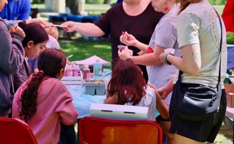 Youth enjoyed the cool breeze, sunshine and wide selection of paint supplies at this event activity during Arts in the Park on Saturday, hosted by the Lampasas Association for the Arts. joycesarah mccabe | dispatch record