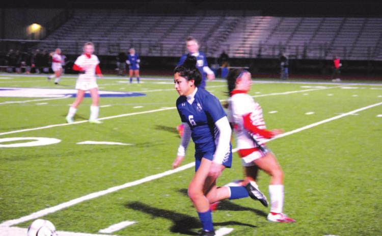 Kailyn Cisneros dribbles past a Salado Lady Eagle player in last week’s contest. HUNTER KING | DISPATCH RECORD