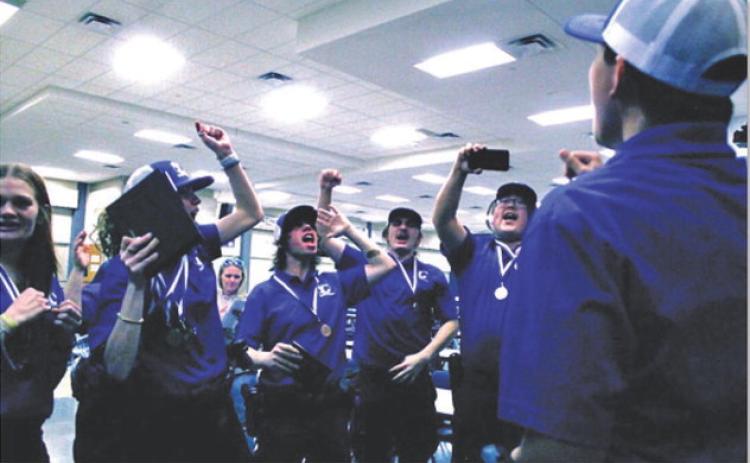 Lampasas High School law enforcment team members celebrate at the regional compeition on Dec. 6 after learning of their success. Many law enforcement, firefighting, and EMT teams secured a place at the upcoming state competition in Febuary following the regional meet. COURTESY PHOTO
