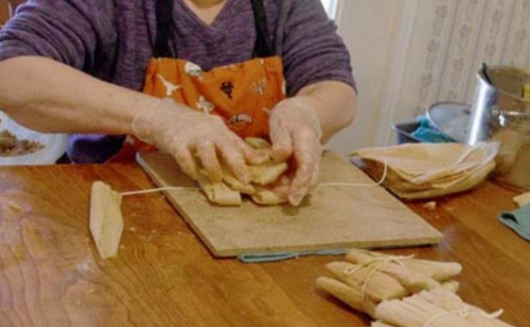 Leonila Gill assembles tamales, which she often makes in batches of 12 dozen at Christmastime. MADELEINE MILLER | DISPATCH RECORD