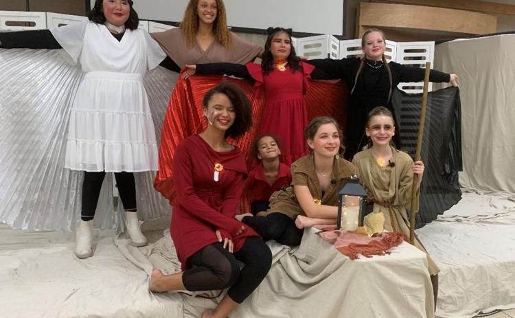 Providence Christian Academy theater instructor Juliana Dwamena, standing second from left, poses with cast members of “The Fire Within.” courtesy photo