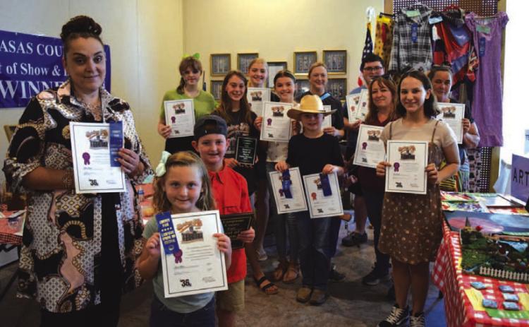 County Fair Best of Show winners in every age division and category pose for a photo during Spring Ho Festival week. ALEXANDRIA RANDOLPH | LAMPASAS DISPATCH RECORD
