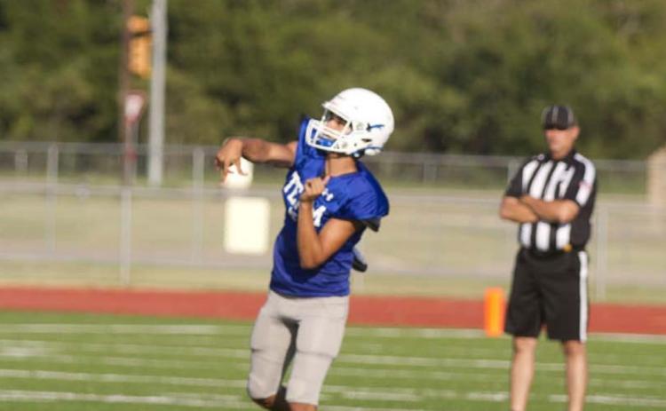 Badger quarterback Dylan Sanchez launches a ball deep into the air looking for a receiver downfield during the first scrimmage against Marble Falls. HUNTER KING | DISPATCH RECORD