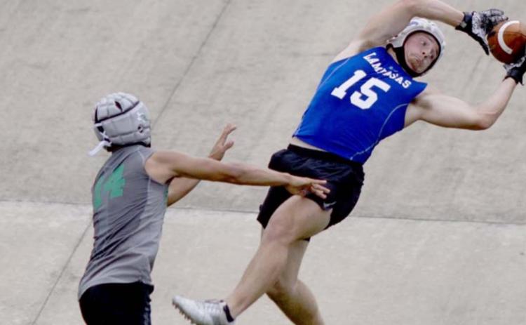 Case Brister goes up to catch a pass during 7-on-7 competition over the summer. FILE PHOTO