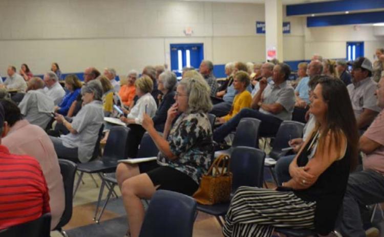 More than 80 parents and residents listened to a solar farm presentation inside the middle school cafeteria Wednesday evening. All who spoke during the open forum session were opposed to the proposal. MONIQUE BRAND | DISPATCH RECORD