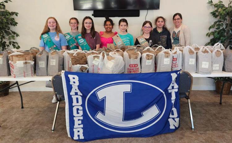 Scouts who worked to pack and sort all the eclipse gift bags are, from left, Troop members Anna Figurski, Jenna Paige Linney, Rylie Wood, Vera-Rose Johnson, Emma-Lee Bull, Isabella Glowinski, Kenzi Rodriguez and leader Torie Lesley. courtesy photo