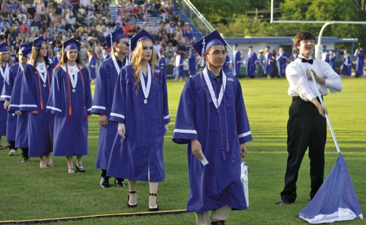 Lampasas High School graduates of 2024 march across Badger Field during a graduation ceremony last Friday to receive their diplomas and honors. ERICK MITCHELL | DISPATCH RECORD