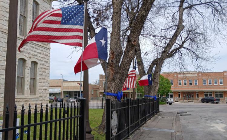 Trees encircling the Lampasas County Courthouse have been adorned with blue ribbons to help bring recognition to child abuse awareness efforts. The blue ribbon is a symbol for Child Abuse Prevention Month, observed annually in April. Jim lowe | dispatch record