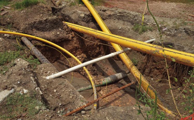 Here is a look at one of the trenches ATMOS Energy crews have dug during their gas line replacement project. ATMOS is replacing old steel lines with polyethylene gas lines (the yellow lines in the photo). The project that started in mid-August is expected to last three months. ERICK MITCHELL | DISPATCH RECORD