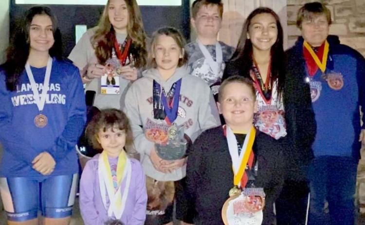 Wrestlers pictured include, front row, left to right, Aviendha and Liam Smith; middle row, Kaitlynn Jones, Taylor Martell, and Charlie Freese; back row: Mia Martell, Jayce West and Tristan Jones. Not pictured: Megan Carver, Emma Phillips, Brianna Miller, Jacob Miller, Sean Miller and Lola Miller. COURTESY PHOTO
