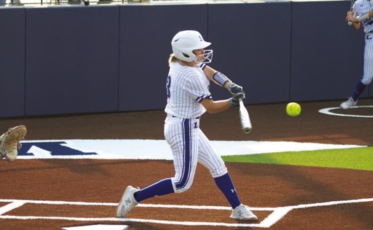 HUNTER KING | DISPATCH RECORD Brady Burton swings and hits one of her two home runs during the game against Jarrell on Tuesday.