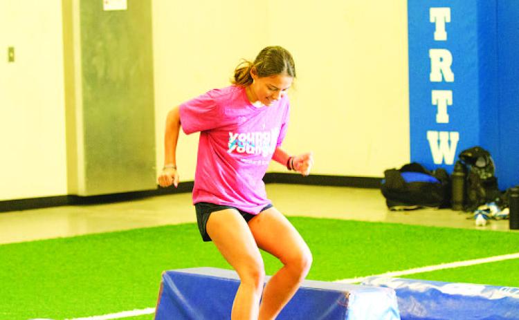 Chloe Thorp works through an agility drill Monday morning at SWAT. HUNTER KING | DISPATCH RECORD