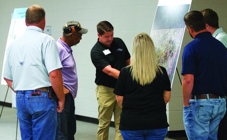 Representatives from Brazos Electric discuss plans for the Beecham Gap transmission line project with area residents at the Copperas Cove Civic and Conference Center on Aug. 6. HUNTER KING | DISPATCH RECORD