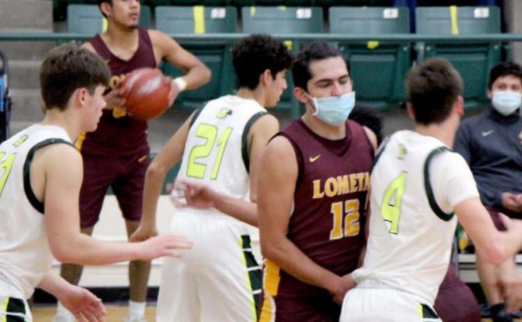 Luis Acevedo (12) sets a screen while Enrique Caso (back-left) looks for a teammate to pass to. JESSICA MALDONADO | LOMETA ISD