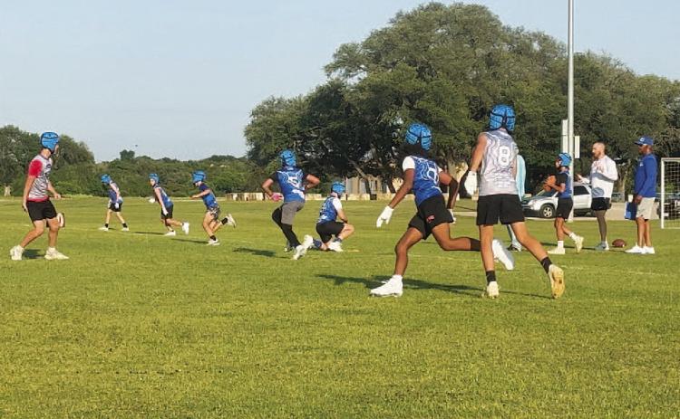 COURTESY PHOTO Fifth- and sixth-grade students run routes and play defense during 7-on-7 in May.