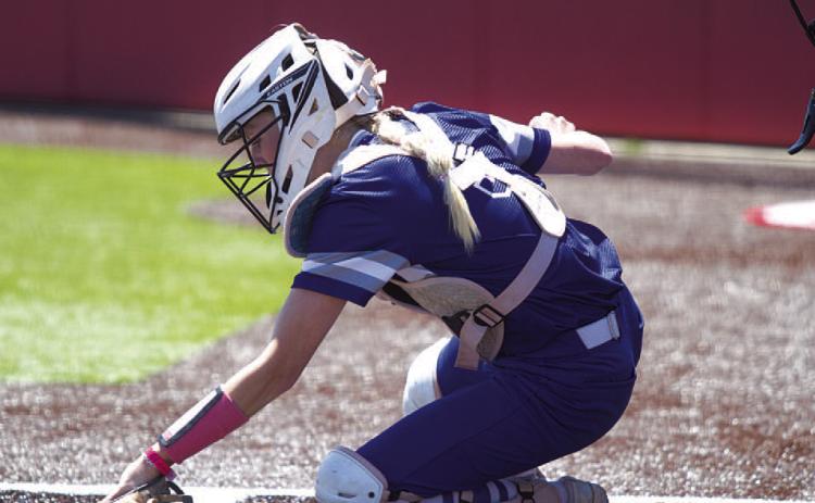HUNTER KING | DISPATCH RECORD Kali Hunter digs out a low pitch during the first game of the bi-district series against Salado last Saturday.